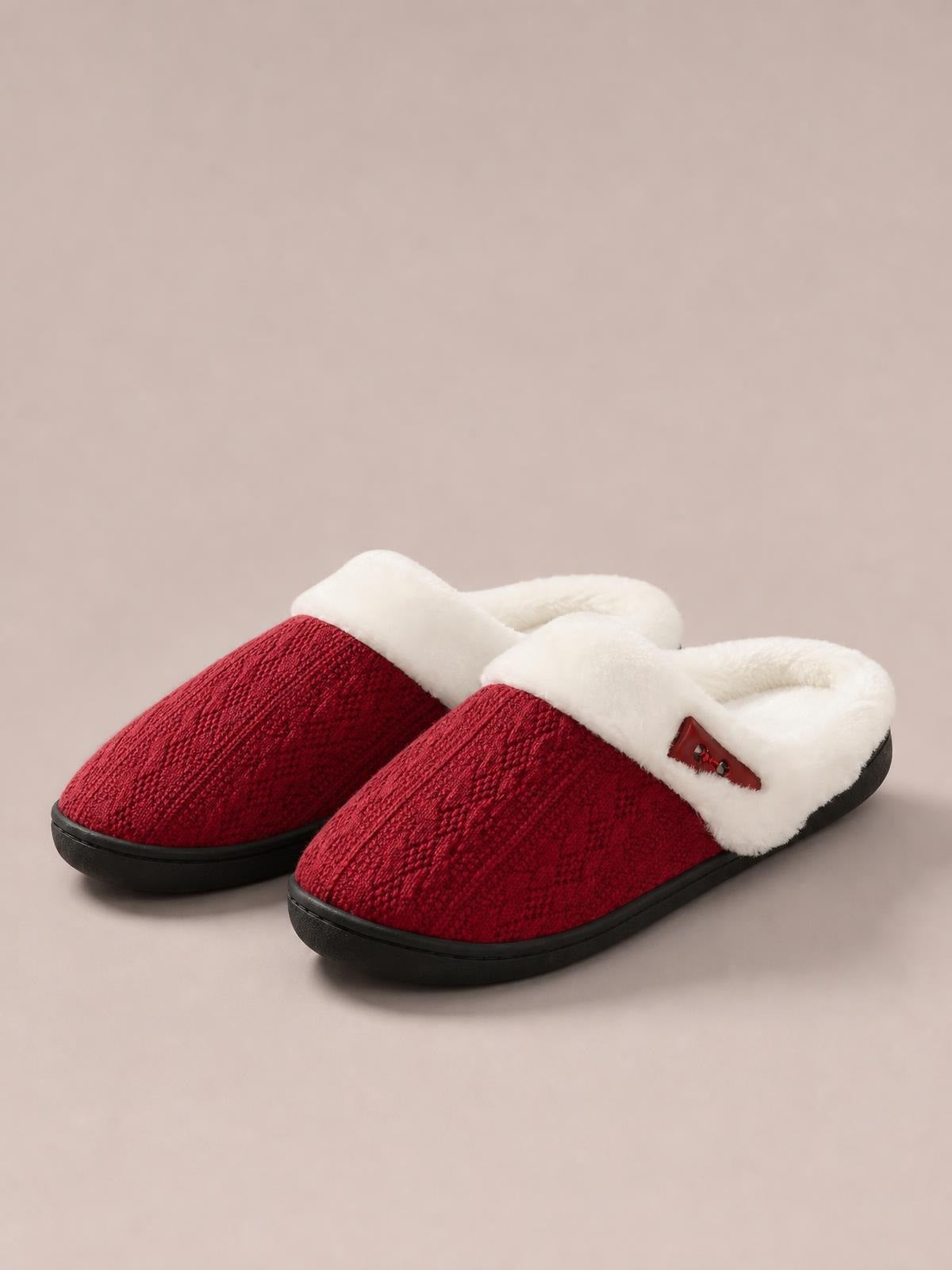 Red furry-texture flat slippers feature soft white fluff lining, a horn-style buckle detail, rounded toes, and sturdy black rubber soles.