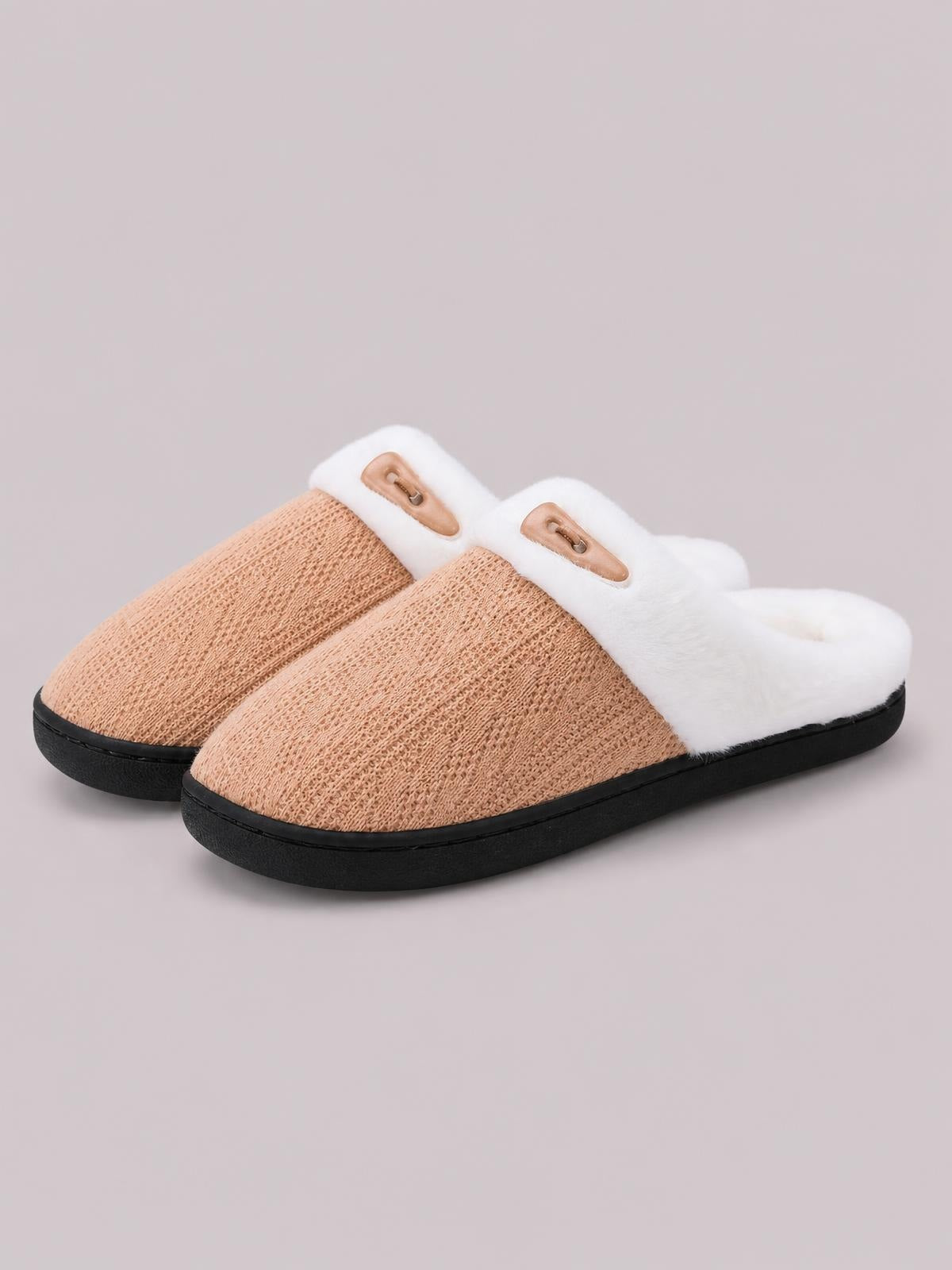Tan flat slippers feature textured knit uppers, soft white furry collars, horn-style buckles, open backs, and sturdy black rubber soles.