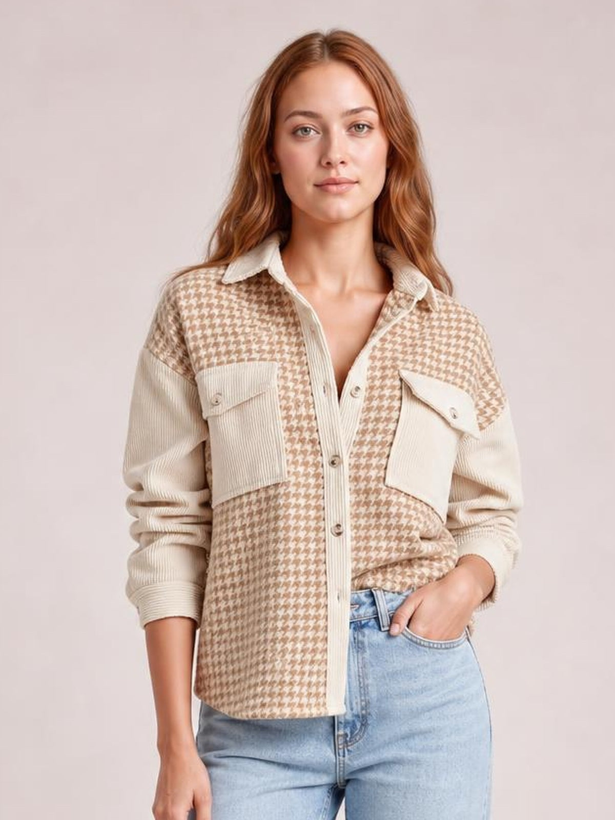 Model wearing a beige houndstooth button-down jacket with a collared design, contrasting ribbed sleeves, front buttons, patch pockets, and a relaxed silhouette.