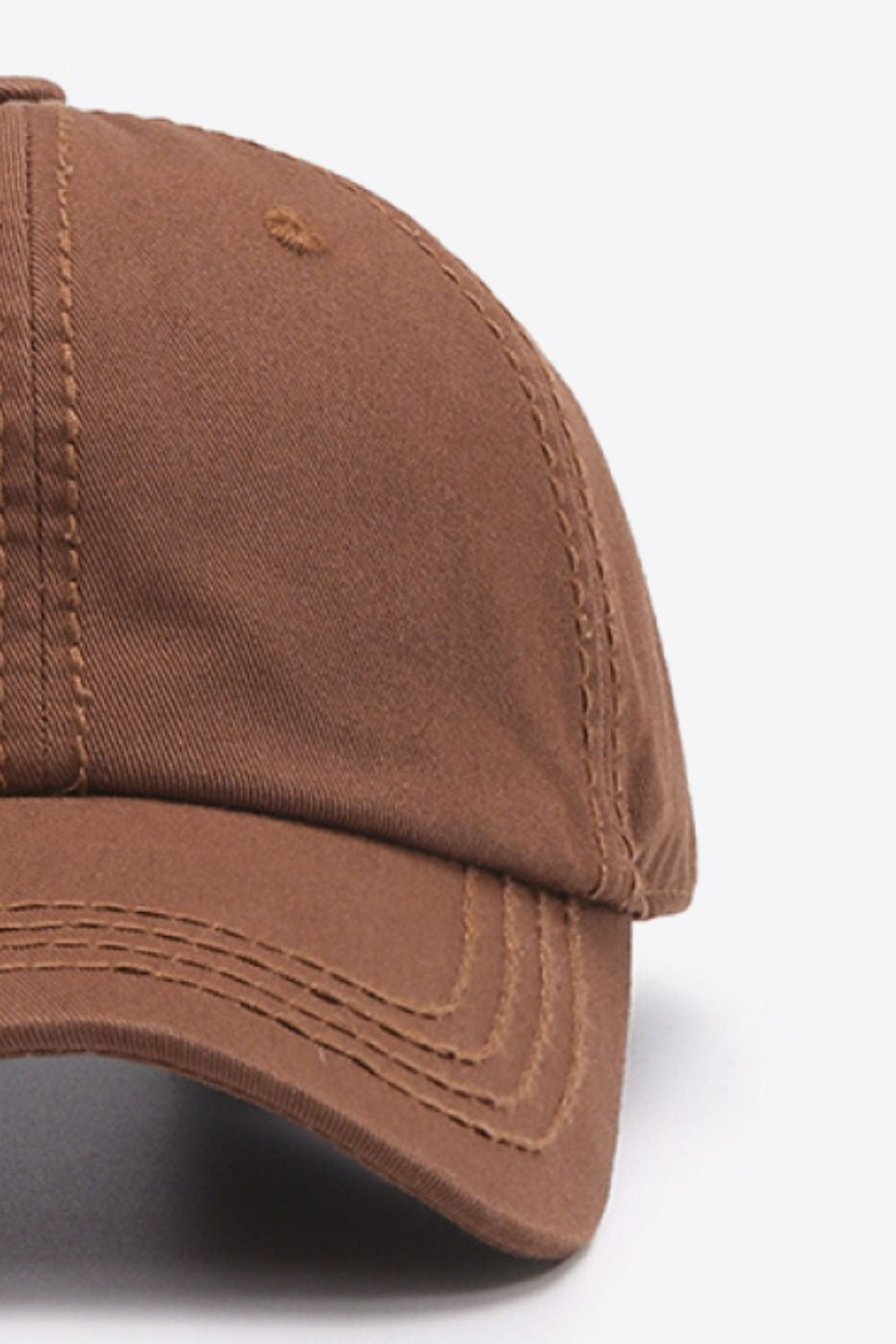 The In A Pretty World baseball cap is shown in brown cotton with a softly structured crown, curved brim, and neat contrast stitching.