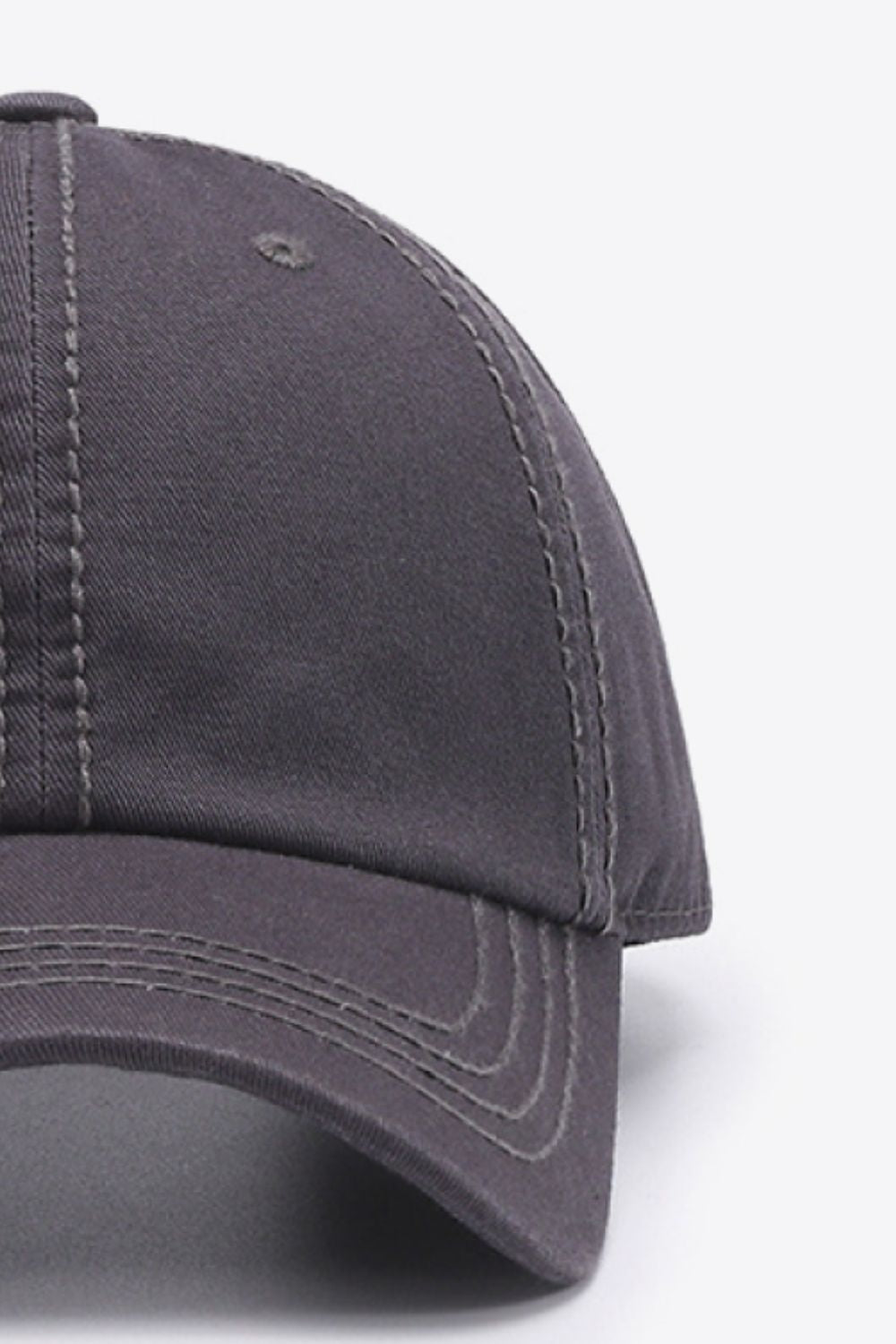 The In A Pretty World baseball cap features a solid charcoal cotton crown, curved brim, softly structured silhouette, and neat tonal stitching.
