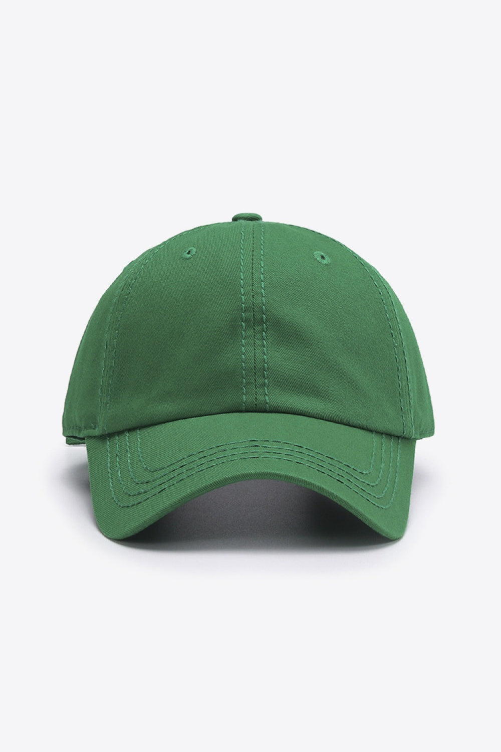 The In A Pretty World baseball cap is a solid green cotton style with a softly structured crown, curved brim, and neat tonal stitching.