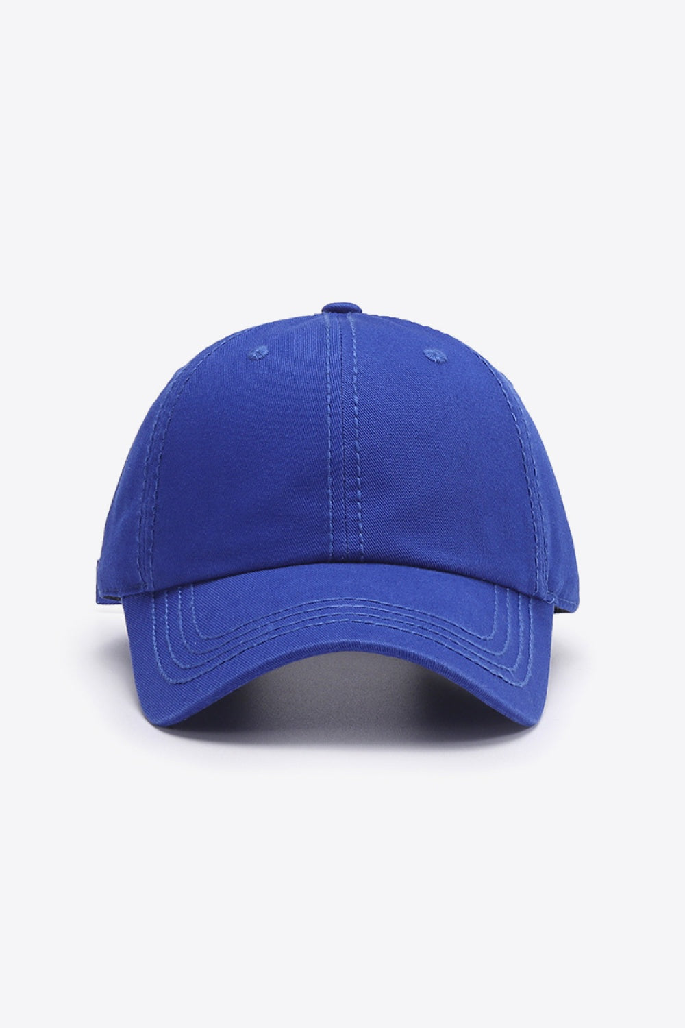 Solid blue cotton baseball cap with a softly structured crown, curved brim, top button, and neatly defined tonal stitching.