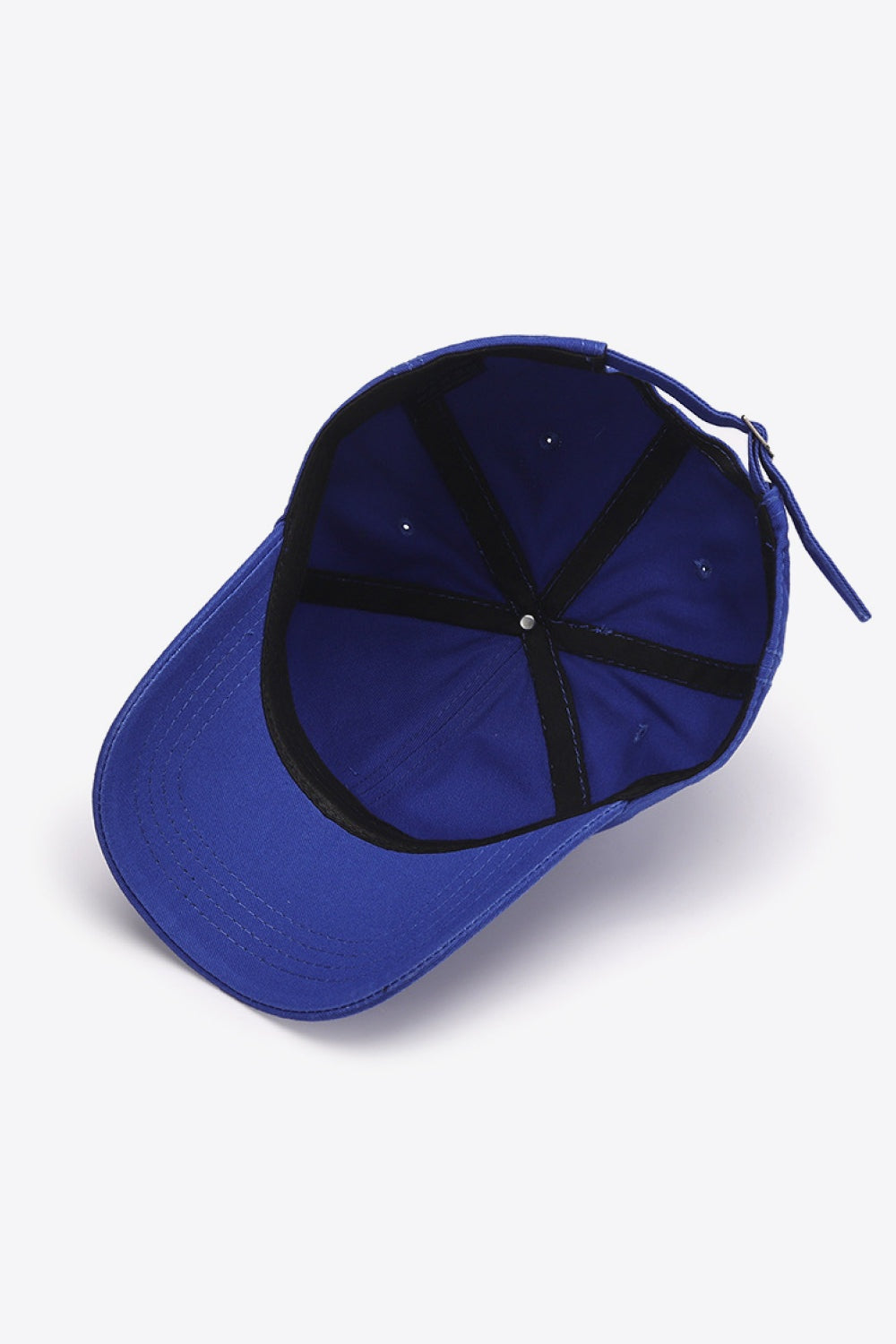 A solid blue In A Pretty World baseball cap shown flat with a curved, stitched brim, softly structured crown, and adjustable rear strap.