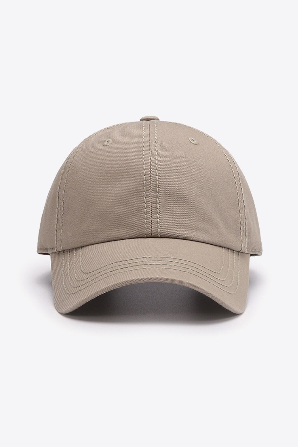 The In A Pretty World baseball cap is a solid taupe cotton style with a softly structured crown, curved brim, and neatly defined tonal stitching.