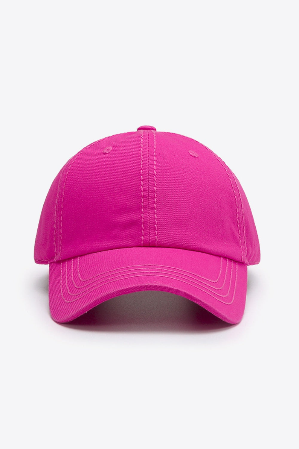 Bright pink solid cotton baseball cap with a softly structured crown, curved brim, and neatly defined stitching for a polished everyday silhouette.
