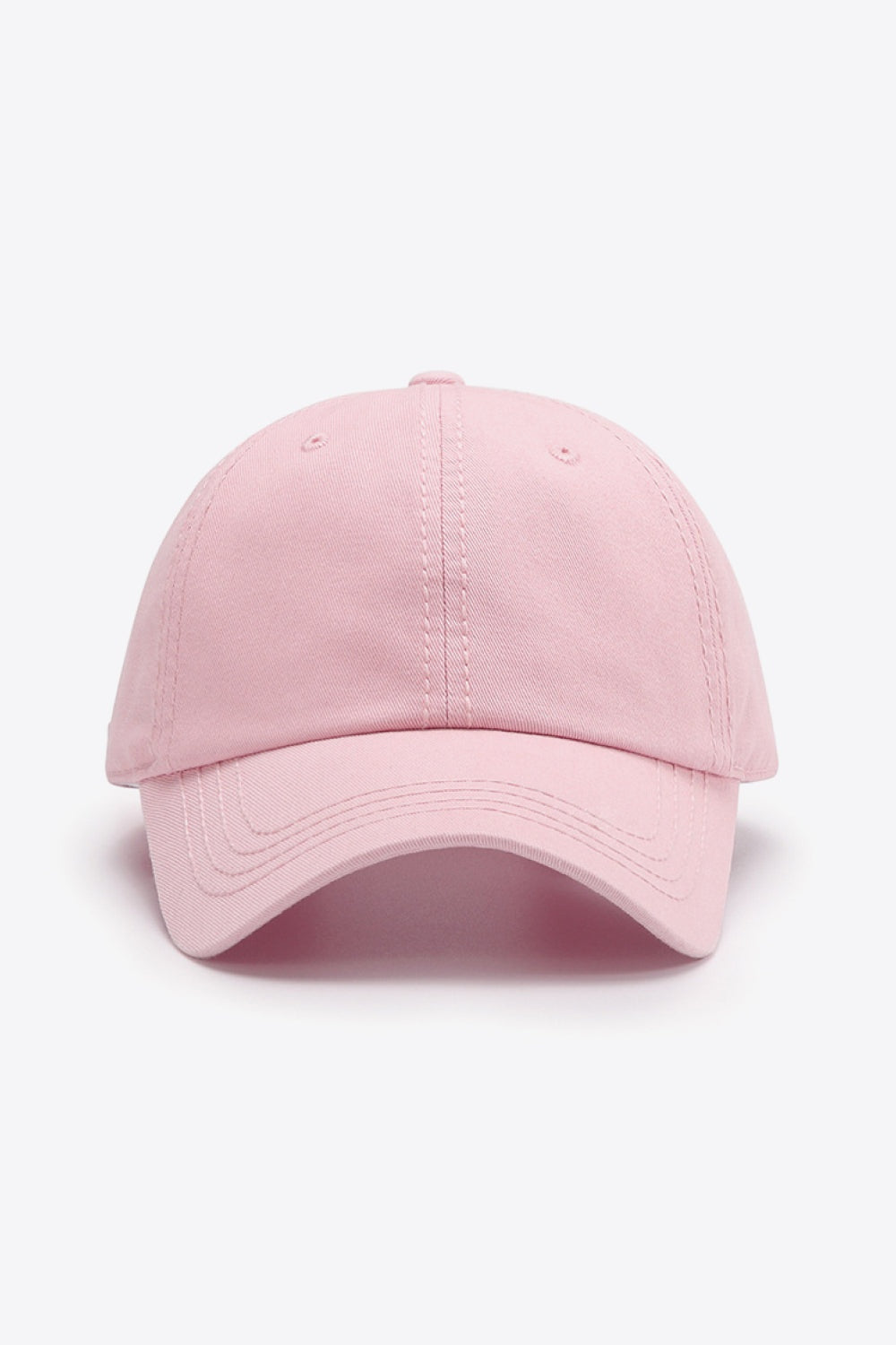 Pink cotton baseball cap with a softly structured crown, curved brim, solid-color design, and neatly defined tonal stitching for a polished everyday silhouette.