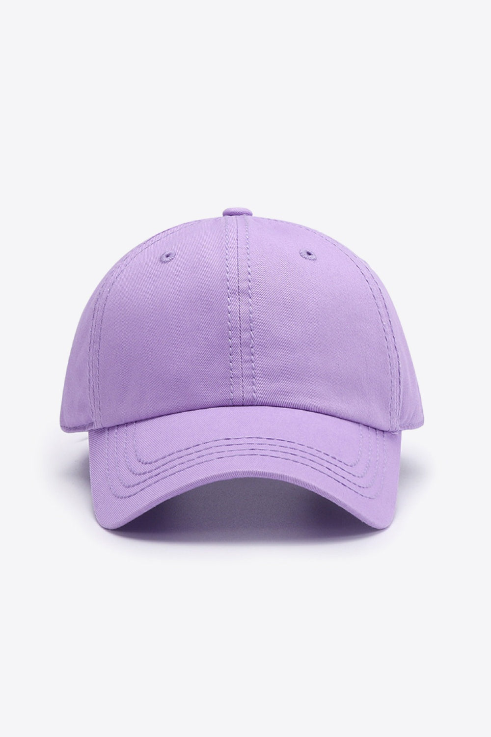 Lavender cotton baseball cap with a softly structured six-panel crown, curved brim, stitched detailing, and matching ventilation eyelets.