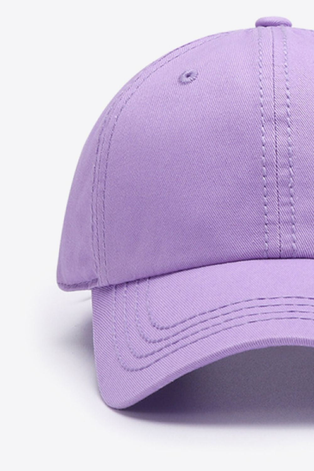 Lavender solid cotton baseball cap with a softly structured crown, curved brim, and neatly defined tonal stitching.