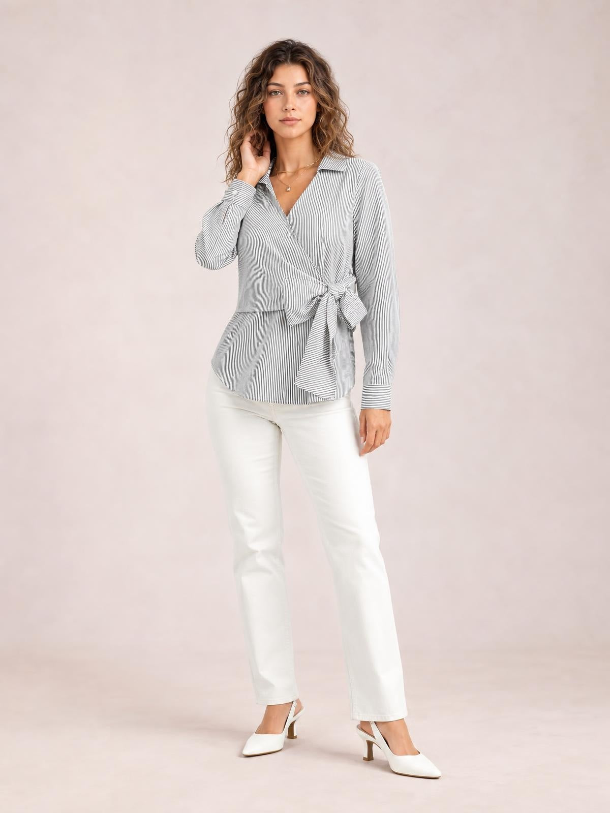 A model poses in a gray-and-white striped blouse with a Johnny collar, long sleeves, regular silhouette, and tied bow waist detail.