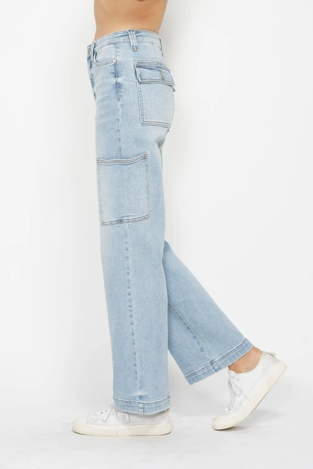 Model shown in profile wearing light-wash high-waist straight cargo jeans with belt loops, stitched utility pockets, and a relaxed straight-leg silhouette.
