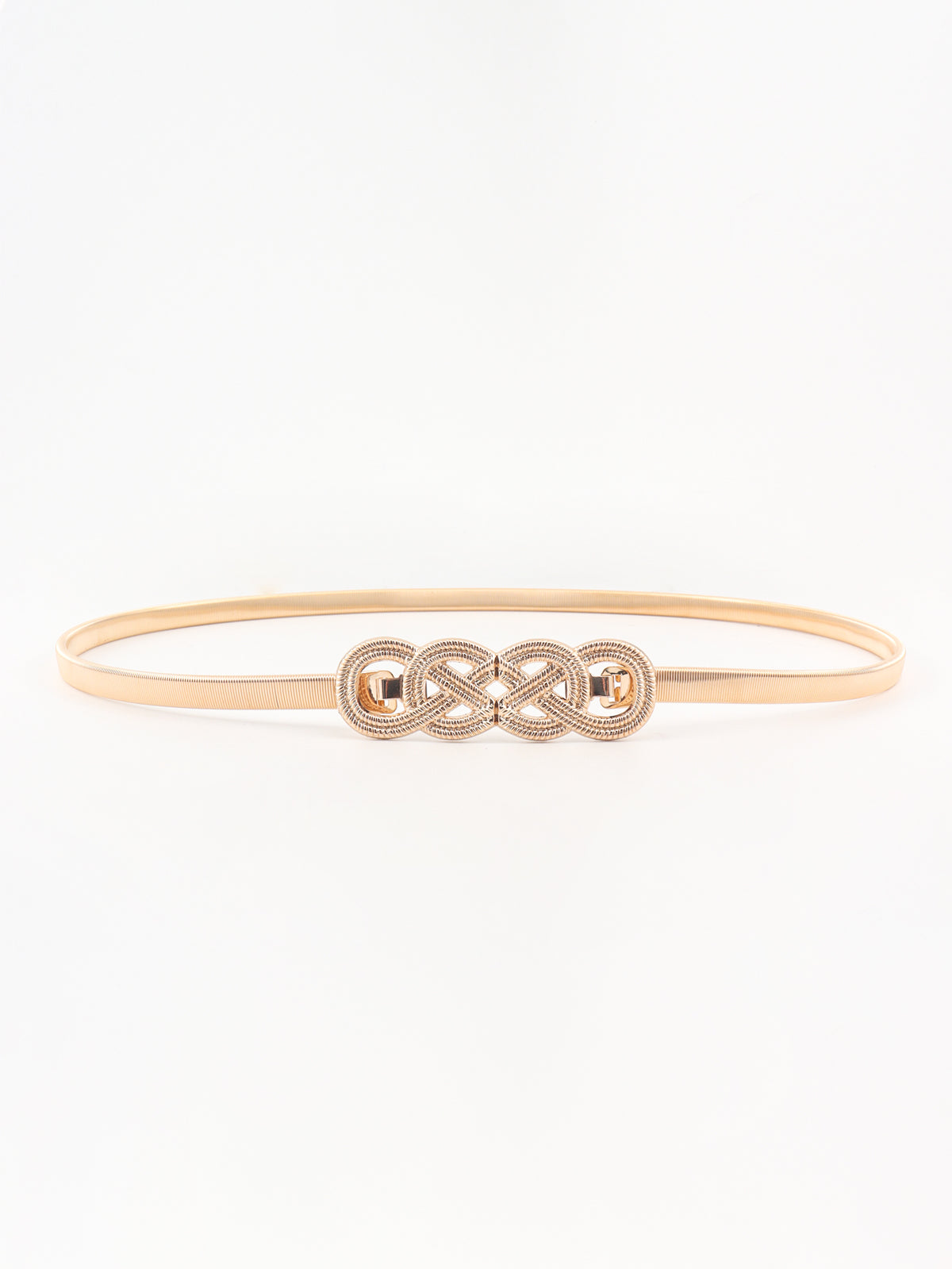 Slim gold-tone metal belt with a subtly textured band and ornate interlocking knot buckle, shown in a streamlined oval silhouette.