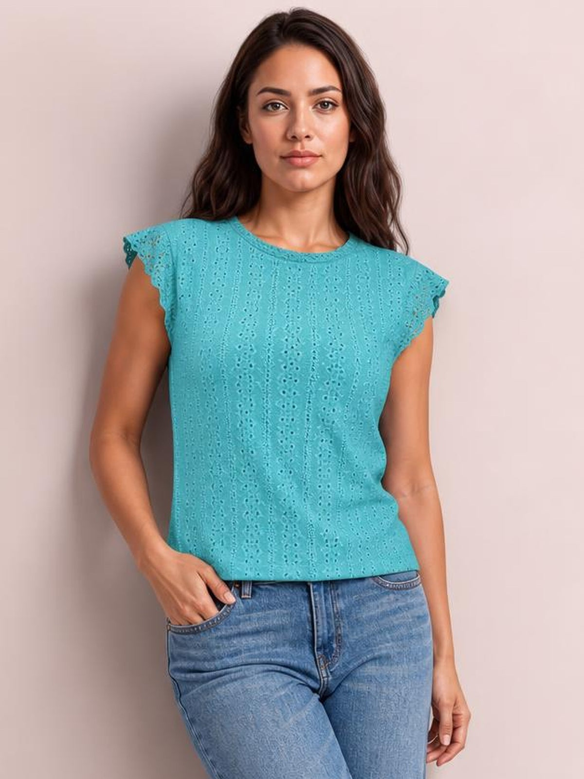 Model wearing a turquoise lace detail round neck cap sleeve top with eyelet texture, scalloped sleeves, and a relaxed straight silhouette.