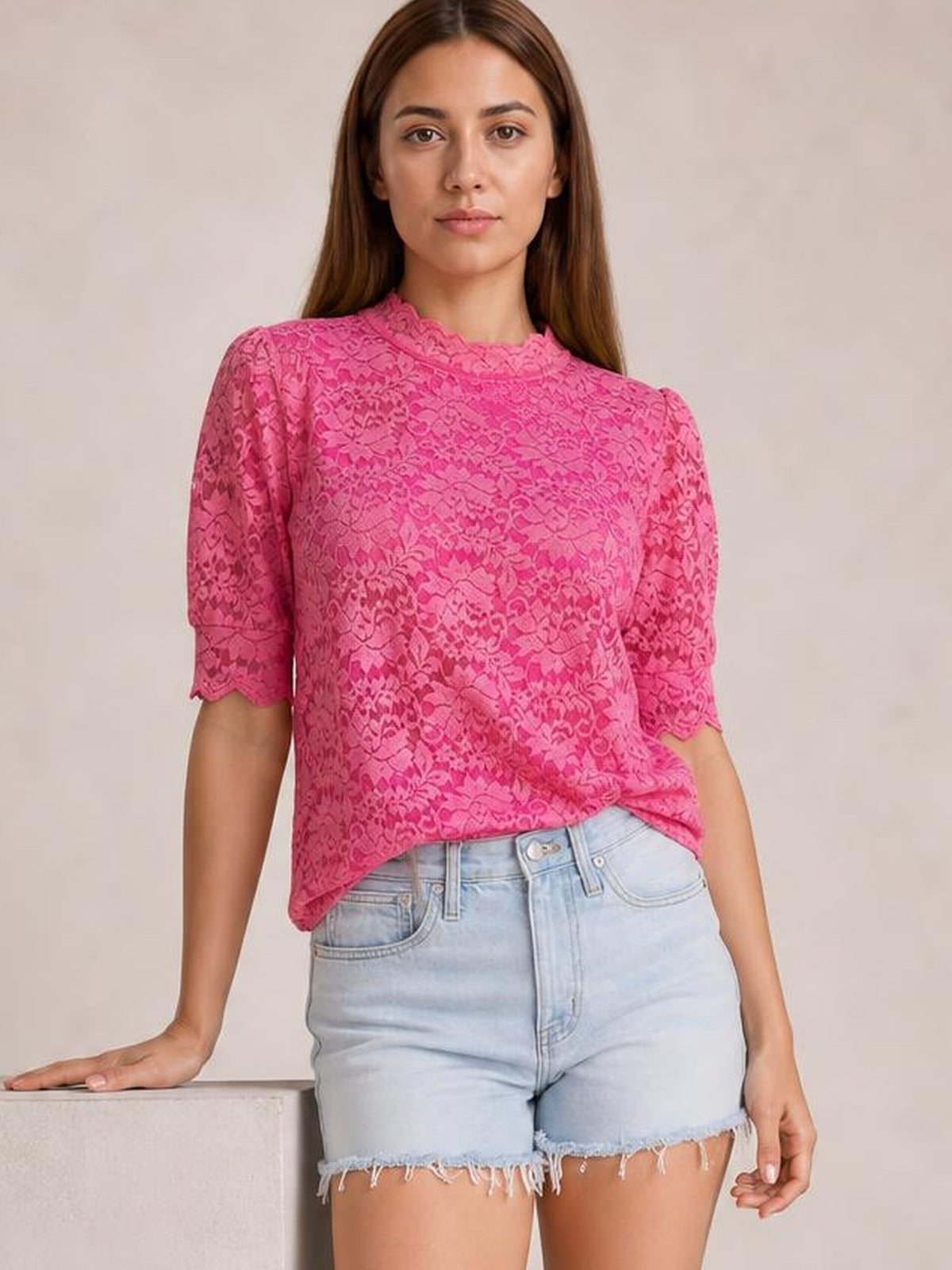 Model wears a bright pink lace top with a scalloped mock neck, short puff sleeves, regular fit, and relaxed straight silhouette.