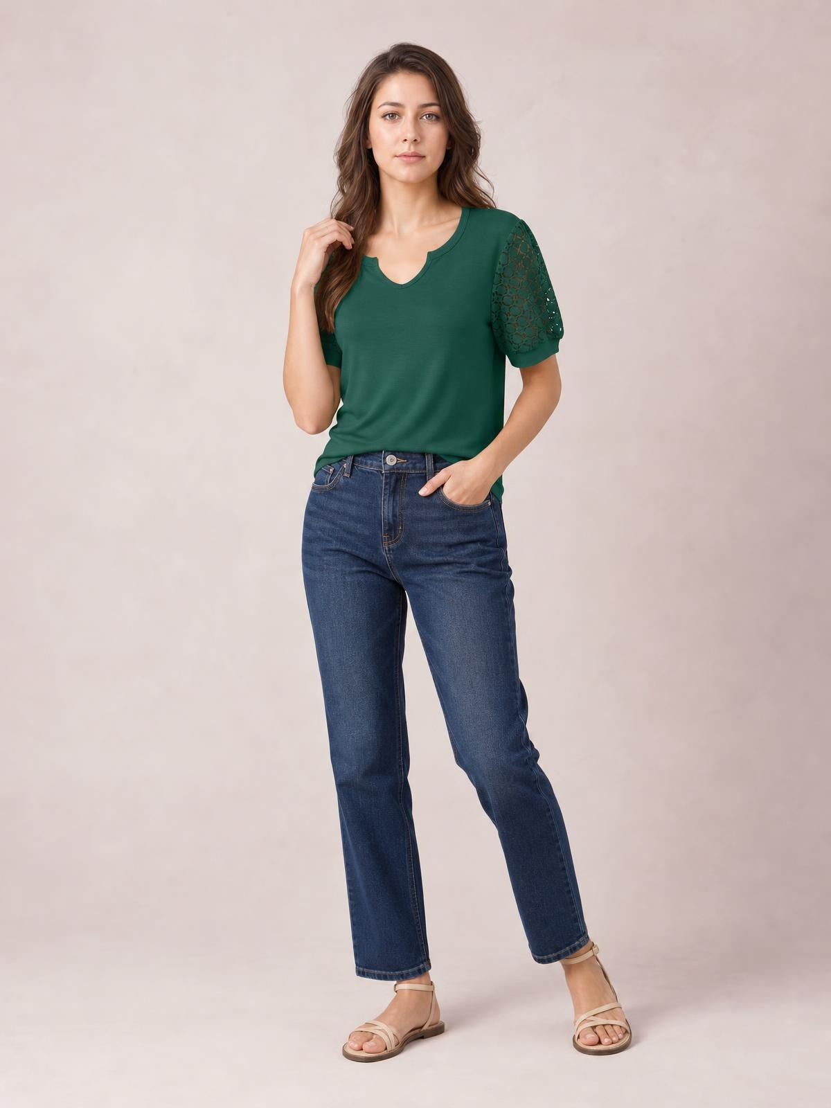 Model poses in a forest-green lace short sleeve T-shirt with openwork sleeves, a relaxed silhouette, and a notched crew neckline.