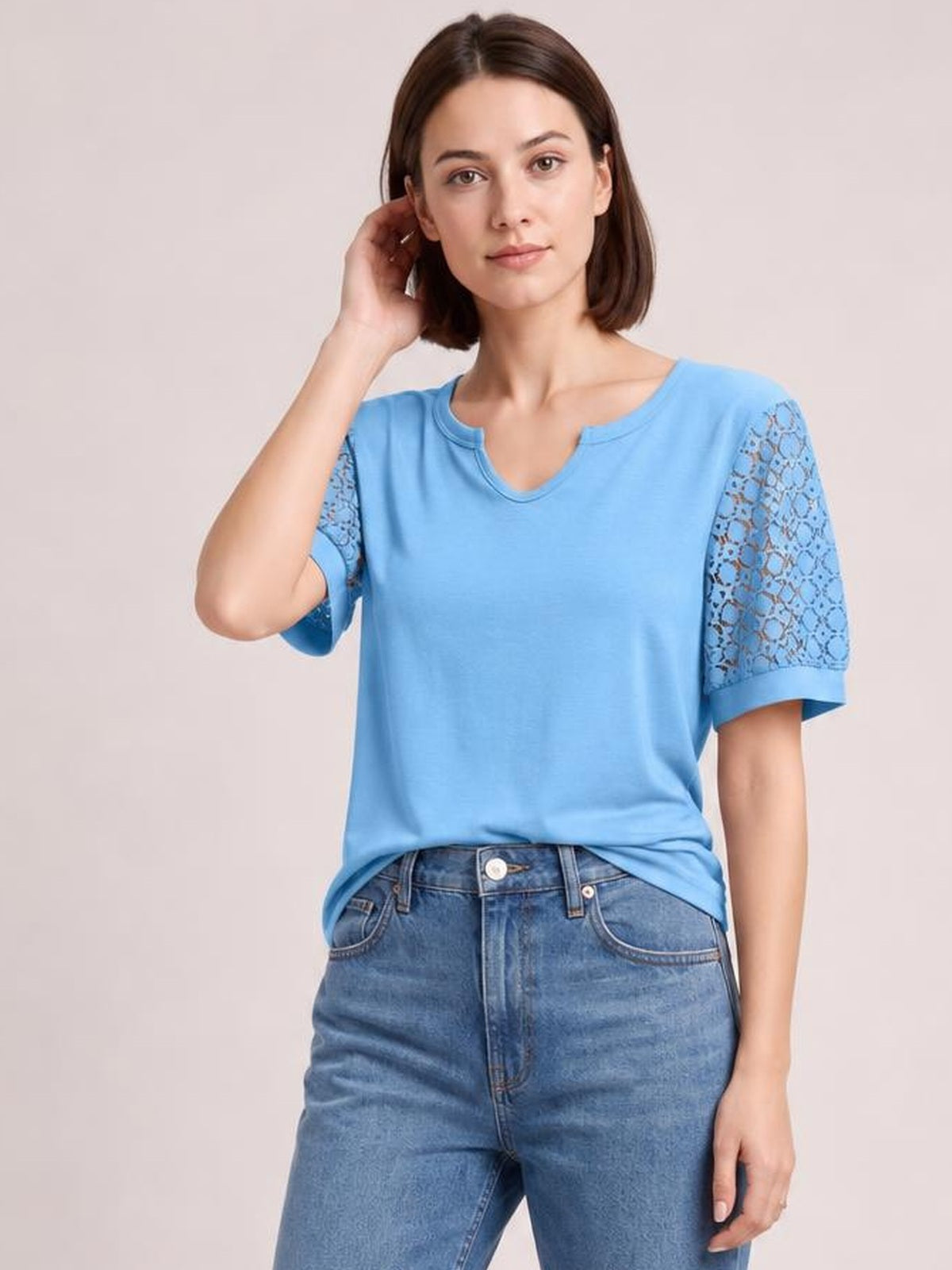 Model wearing a sky-blue Lace Short Sleeve T-Shirt with semi-sheer openwork lace sleeves, a relaxed silhouette, and a notched neckline.