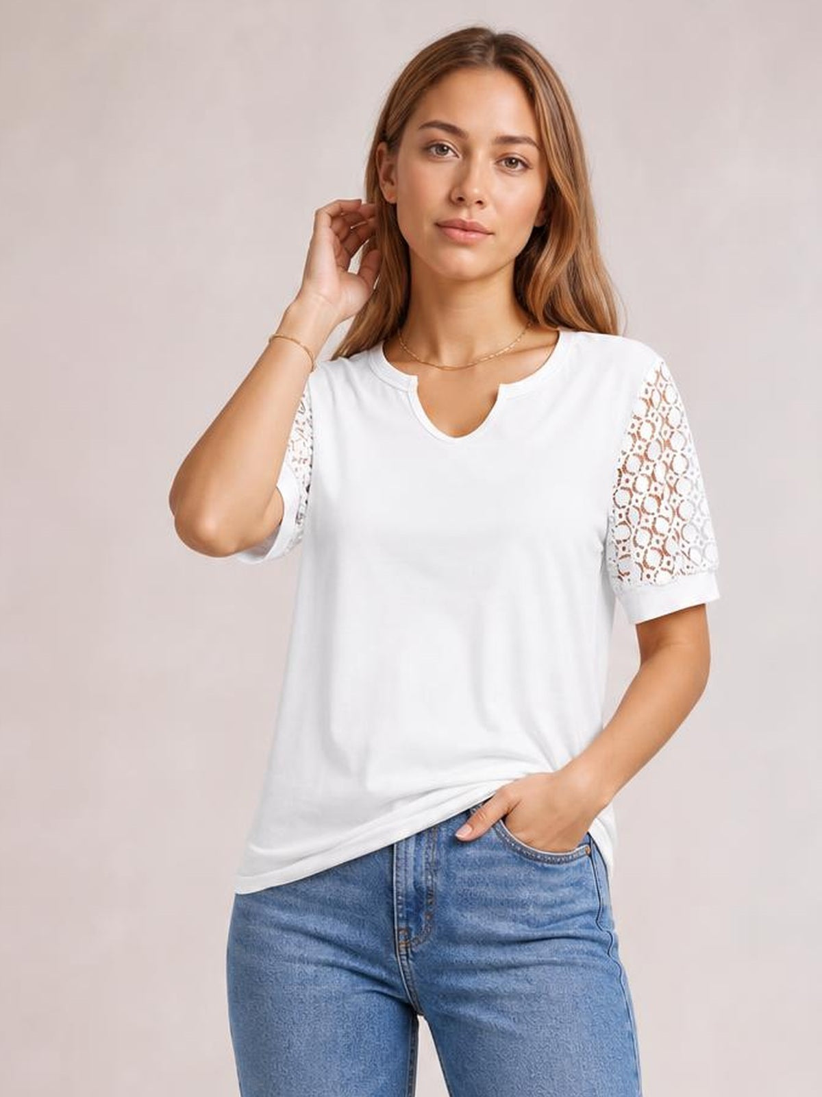 Model poses in a white Lace Short Sleeve T-Shirt with semi-sheer openwork lace sleeves, a relaxed straight silhouette, and a notched round neckline.