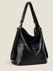 Black medium PU leather convertible shoulder bag with a slouchy silhouette, adjustable strap, soft gathered sides, and a structured front panel.