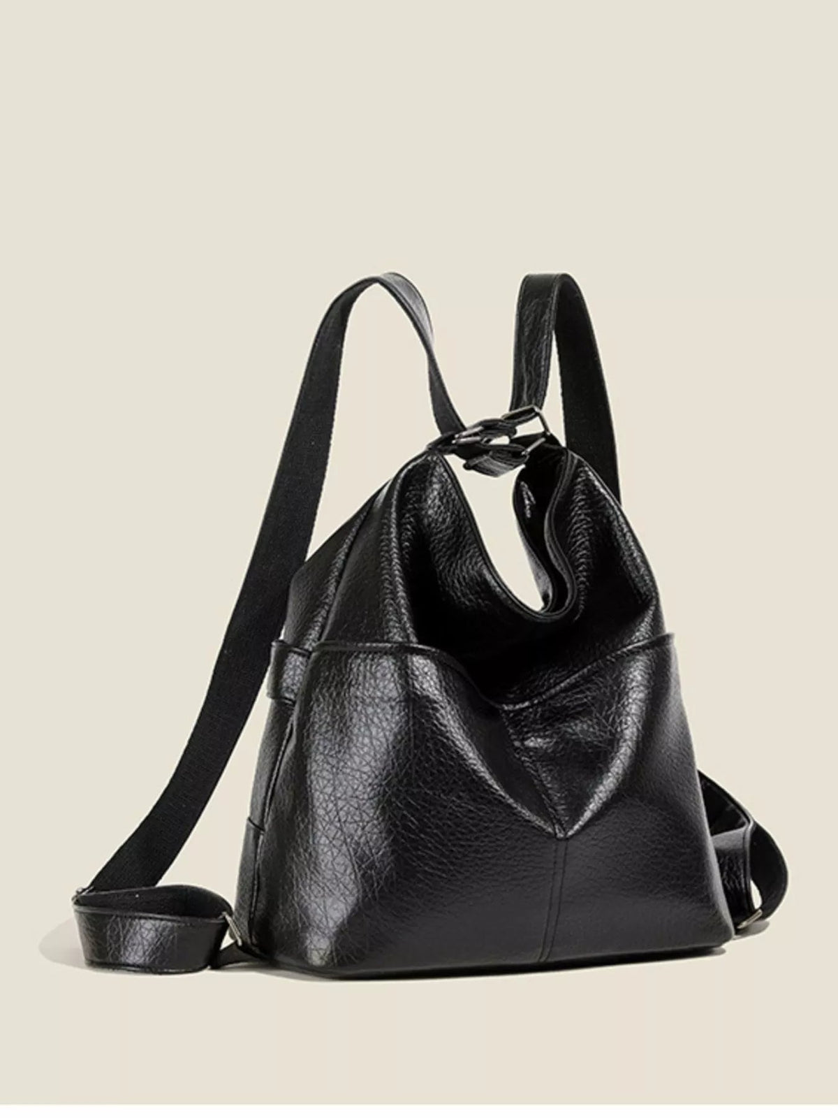 Black medium convertible shoulder bag in pebbled PU leather with a slouchy silhouette, roomy open top, wide straps, and a structured base.