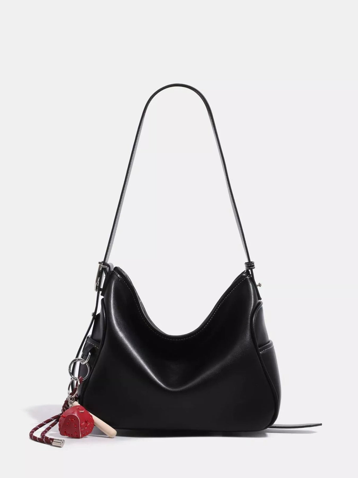 Black medium PU leather slouchy shoulder bag with a soft curved silhouette, long shoulder strap, stitched edges, and silver-tone hardware.