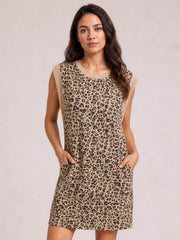 A model wears a tan and black leopard cap-sleeve mini dress with a round neckline, straight silhouette, and visible side pockets.