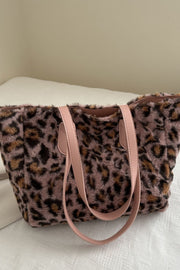 Leopard-print fluff tote bag in mauve brown and black features a softly structured silhouette, plush exterior, and long blush pink PU leather handles.