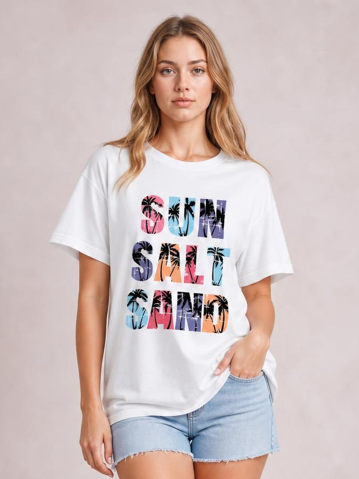 Model wearing a white Letter Graphic Round Neck Tee with colorful palm-print lettering, regular short sleeves, and a relaxed regular-length silhouette.