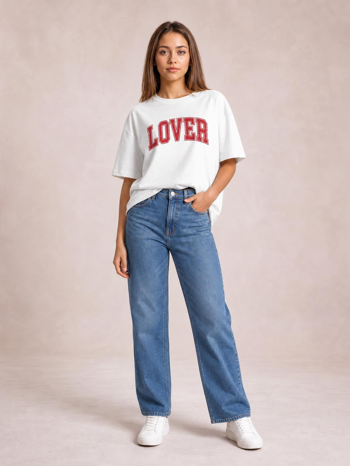 Model poses in a white round neck half sleeve T-shirt with red “LOVER” lettering, relaxed oversized silhouette, and a slightly curved hem.