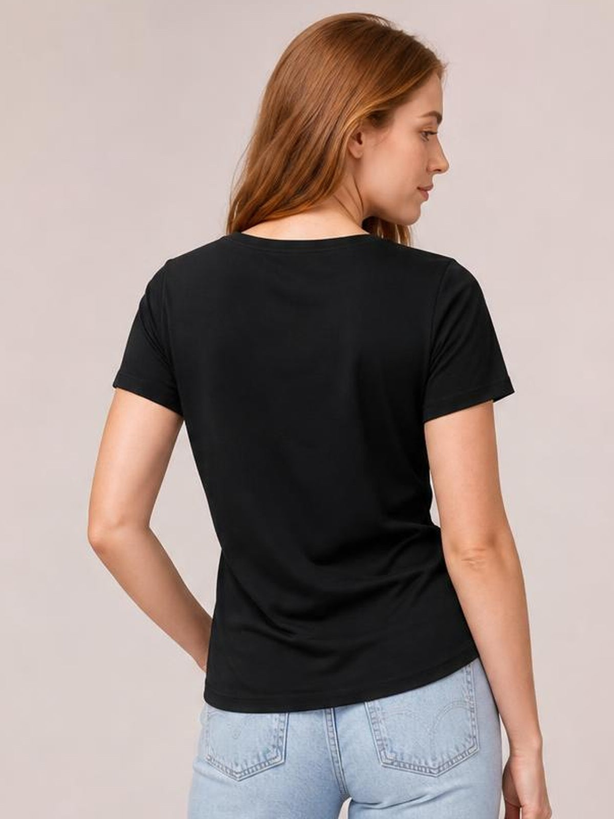 Model shown from the back in a black Lucky Letter Clover short sleeve T-shirt with a crew neck and straight, relaxed silhouette.