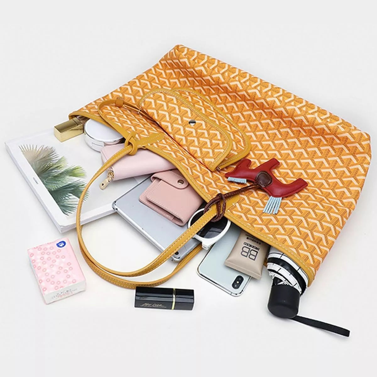 Large mustard PU leather tote handbag with a geometric pattern, double top handles, a detachable front pouch, and a red horse charm.