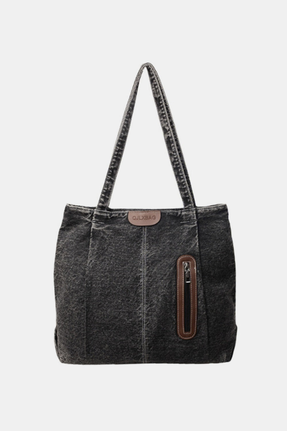 Medium black denim tote bag with a structured silhouette, softly rounded corners, twin shoulder straps, vertical panel seams, and a front zip pocket with faux-leather trim.