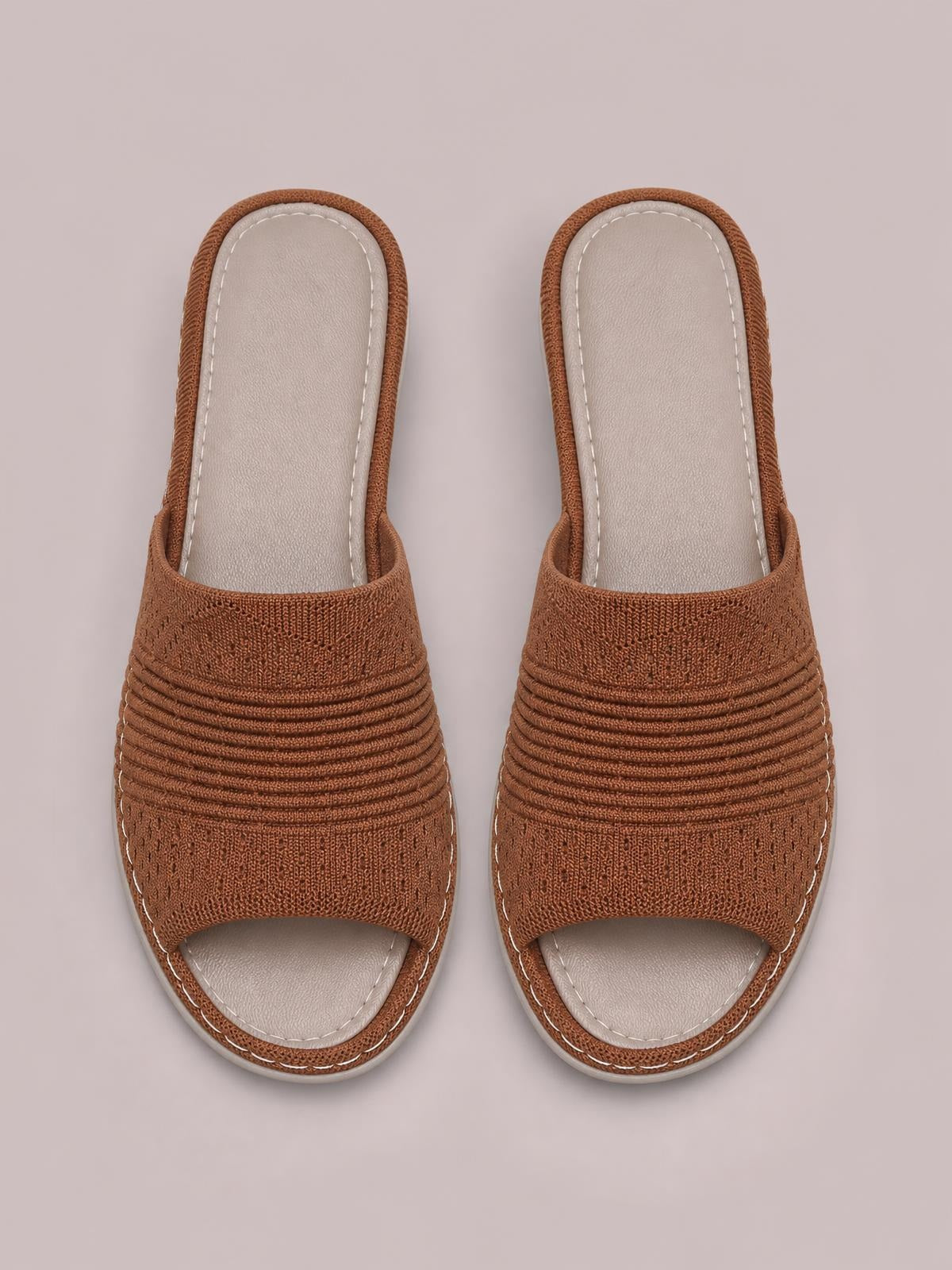 Brown mesh open-toe flat sandals with wide ruched straps, cushioned light insoles, stitched edging, and flexible rubber soles.