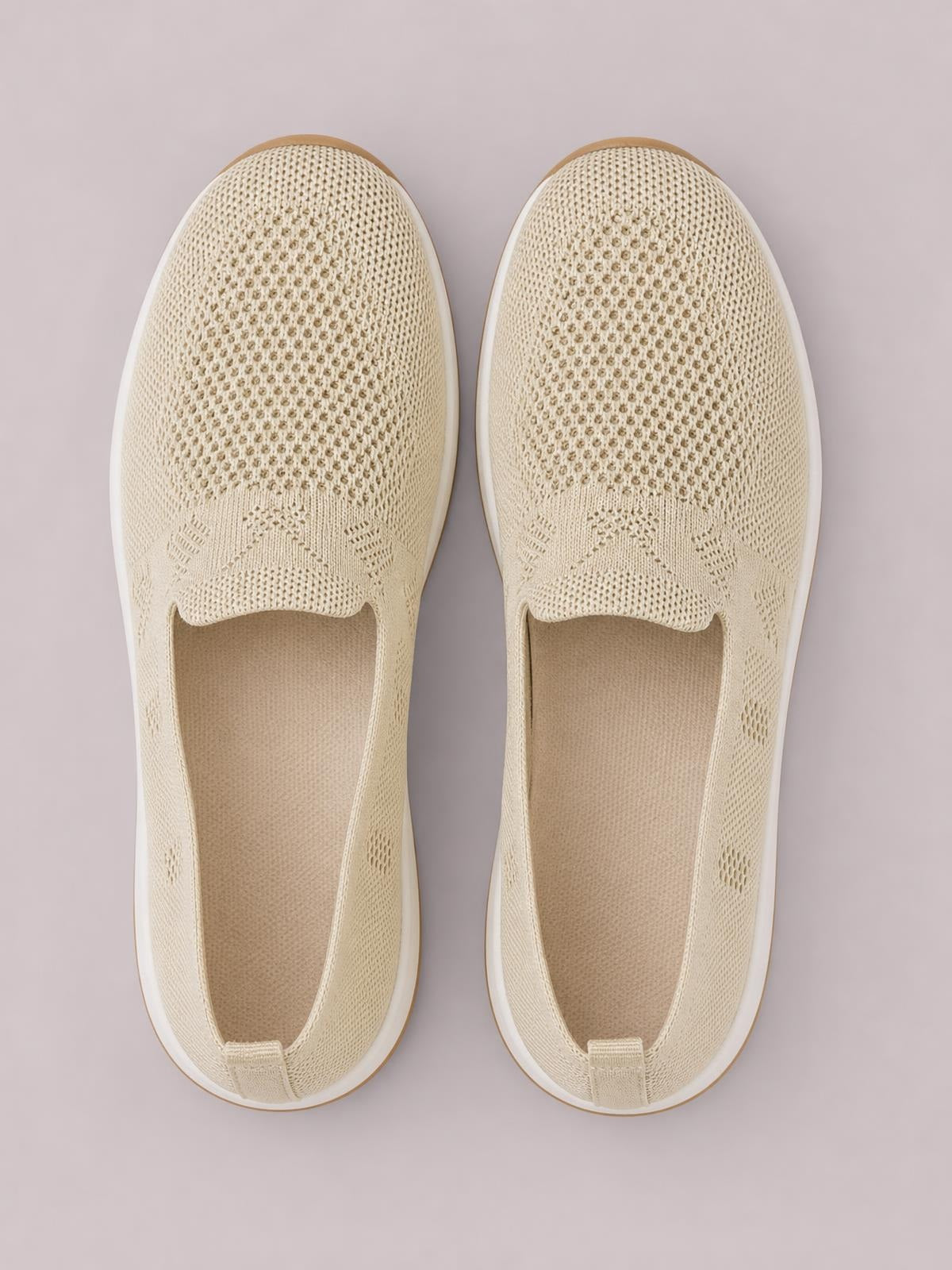 Cream mesh round-toe flat slip-ons feature breathable knit uppers, open elasticated collars, cushioned insoles, and white rubber soles.