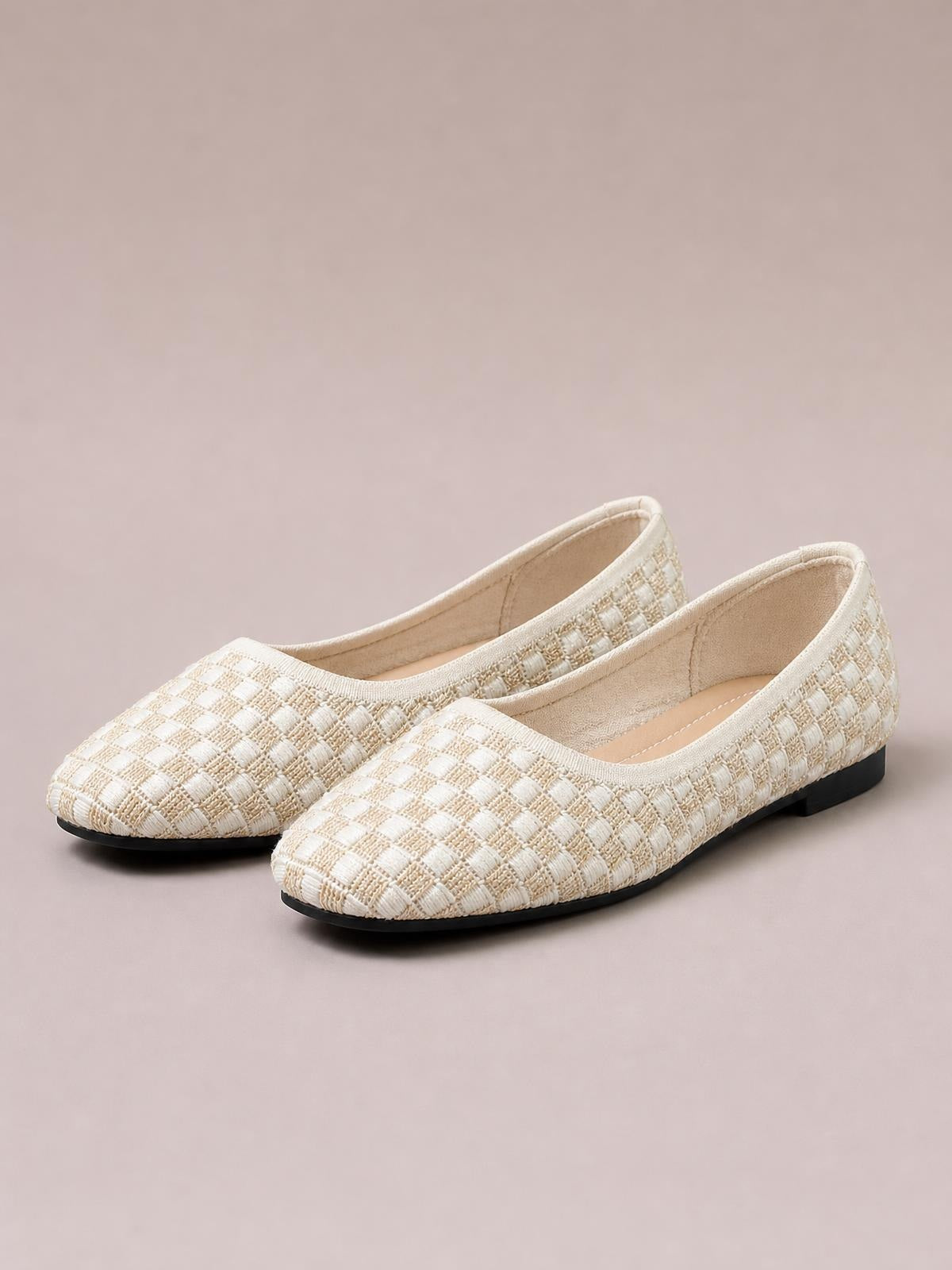 Cream mesh round-toe flat slip-ons feature a woven textured upper, low-cut opening, streamlined silhouette, and contrasting black rubber soles.