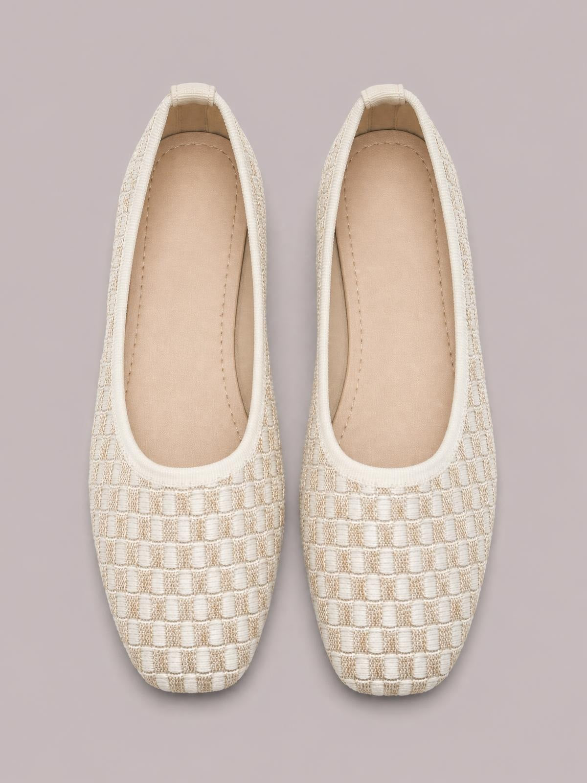 Pair of cream mesh round-toe flat slip-ons with a woven grid texture, cushioned insoles, and neatly stitched edging.