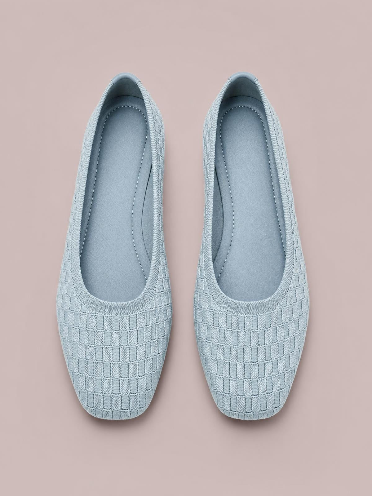 Pair of pale blue mesh round toe flat slip-ons feature a woven grid upper, neat stitched edging, and a streamlined low-profile silhouette.