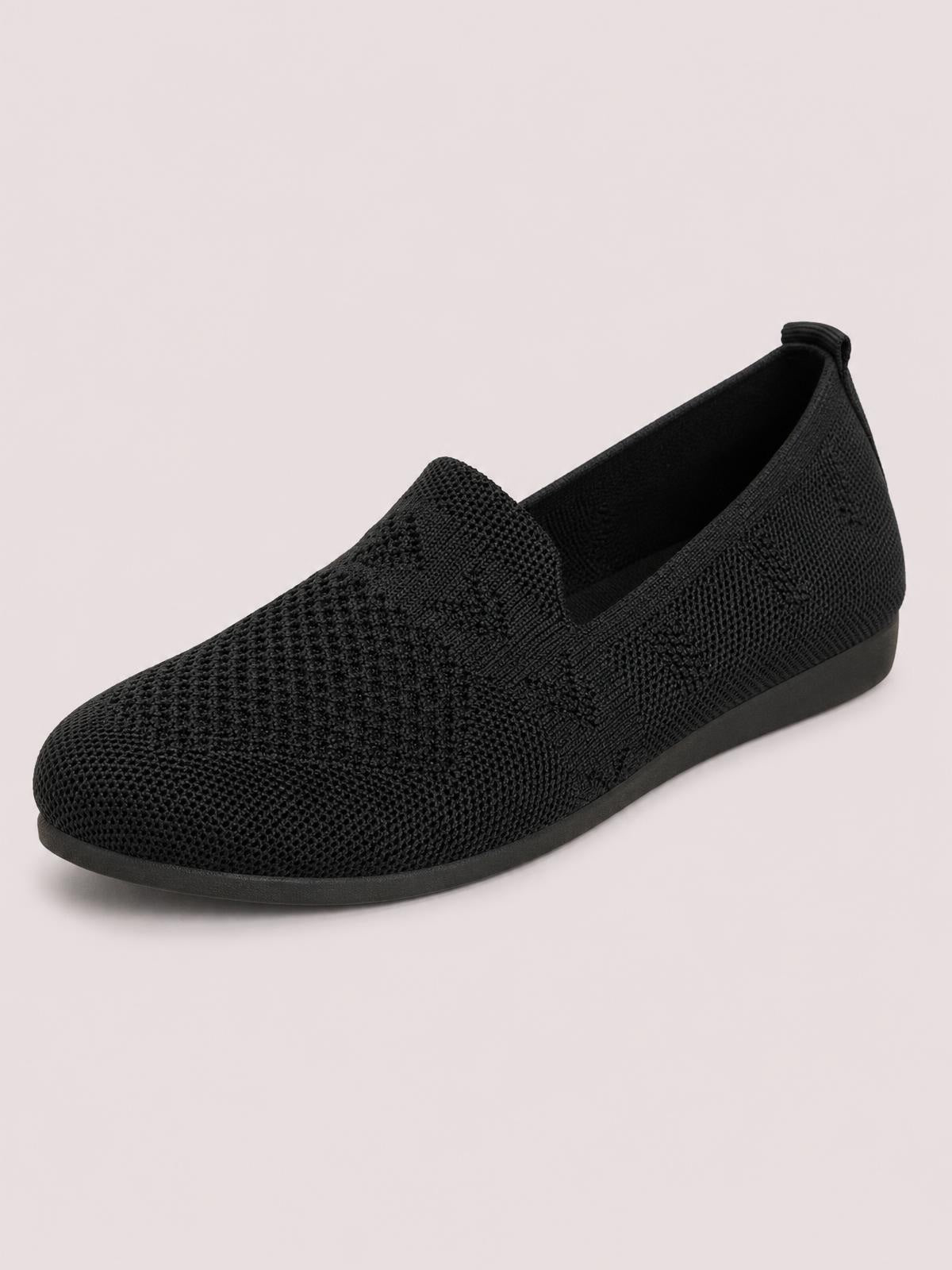 Black mesh round-toe flat slip-on shoe with a textured knit upper, low rubber sole, and elastic opening for easy wear.