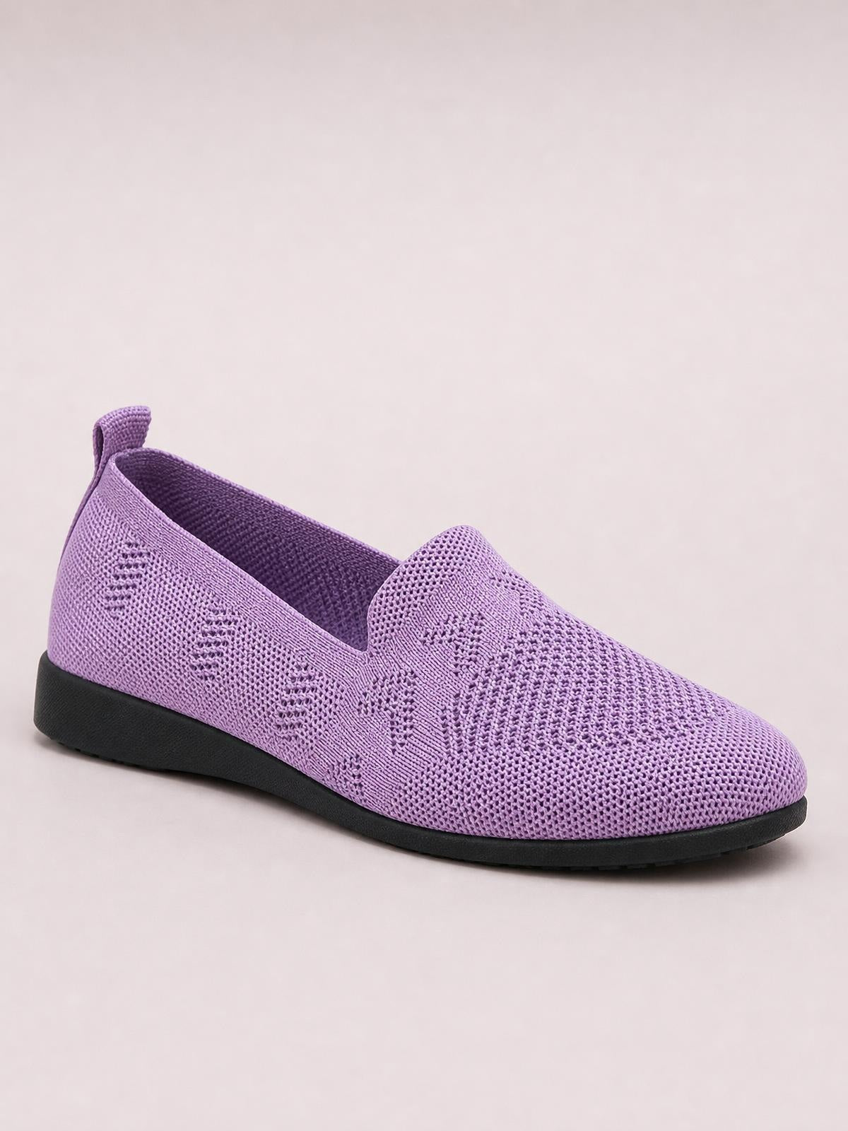 Lavender mesh round-toe flat slip-on with a textured knit upper, easy slip-on opening, heel pull tab, and contrasting black rubber sole.
