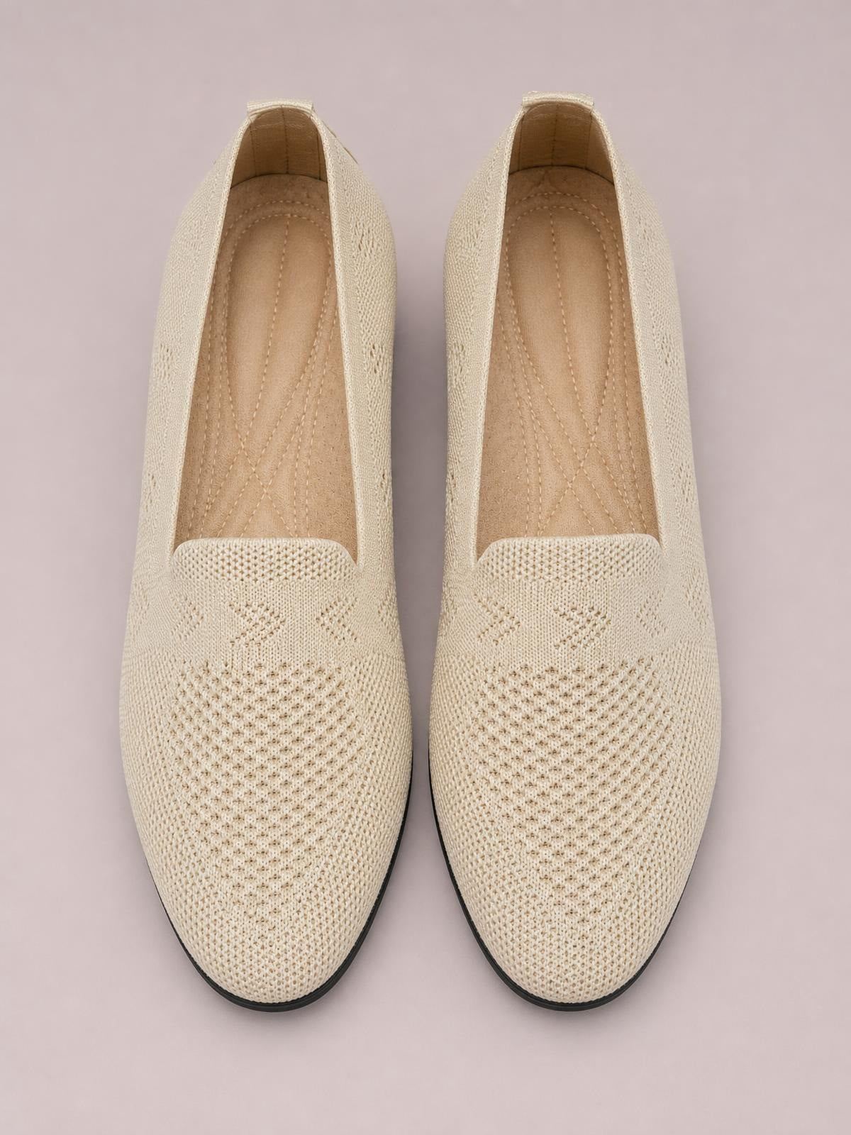Cream mesh round-toe flat slip-ons with breathable woven uppers, cushioned insoles, and slim dark rubber soles.