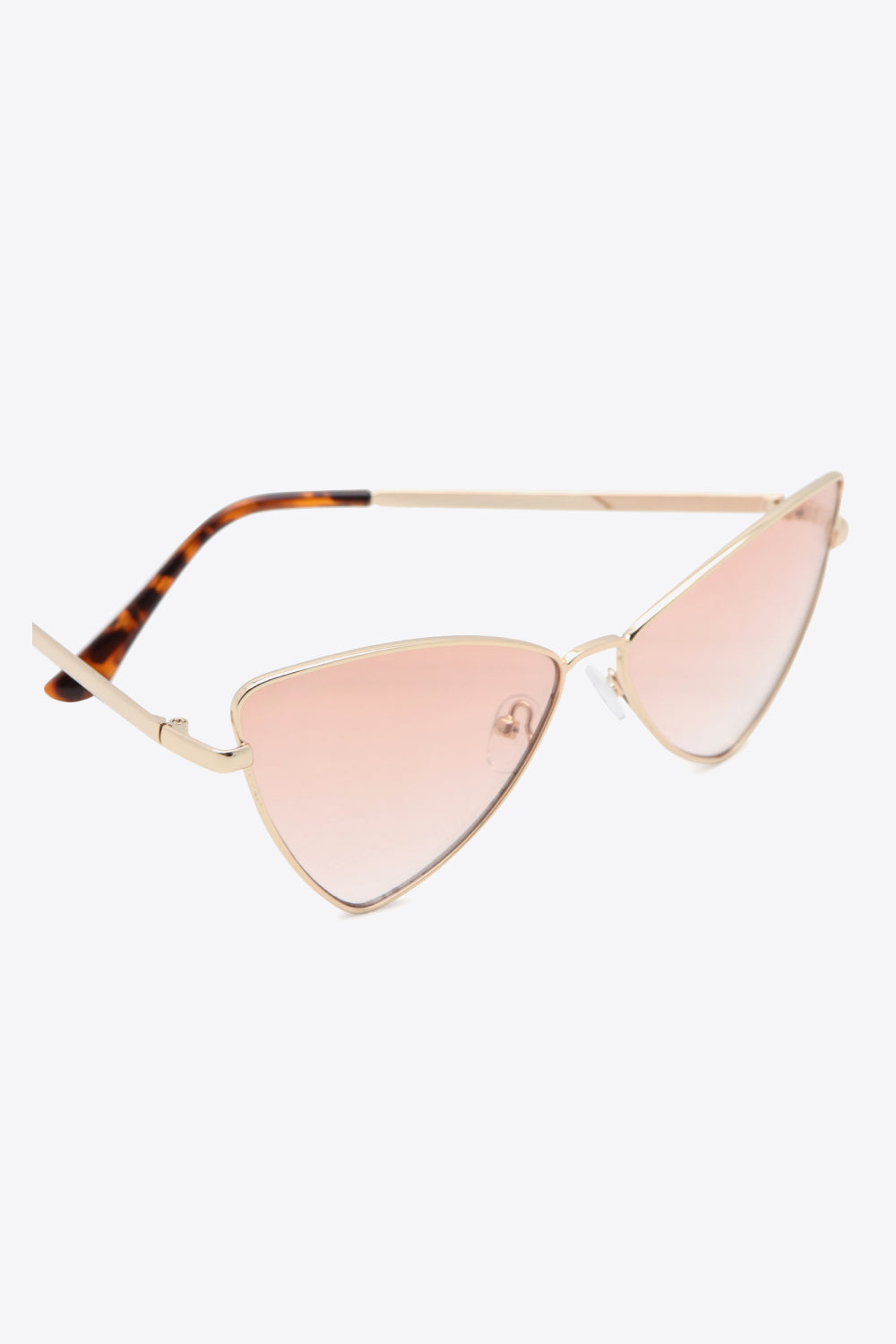 Metal frame cat-eye sunglasses feature softly pointed gold rims, pink-tinted lenses, and tortoiseshell-inspired metal-plastic hybrid temples.