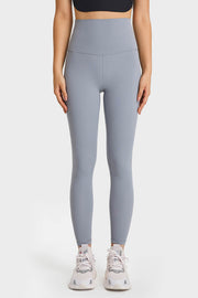 Model stands with hands at her sides wearing solid light gray ultra-soft high waist leggings with a stretchy, close-fitting silhouette and visible seaming.