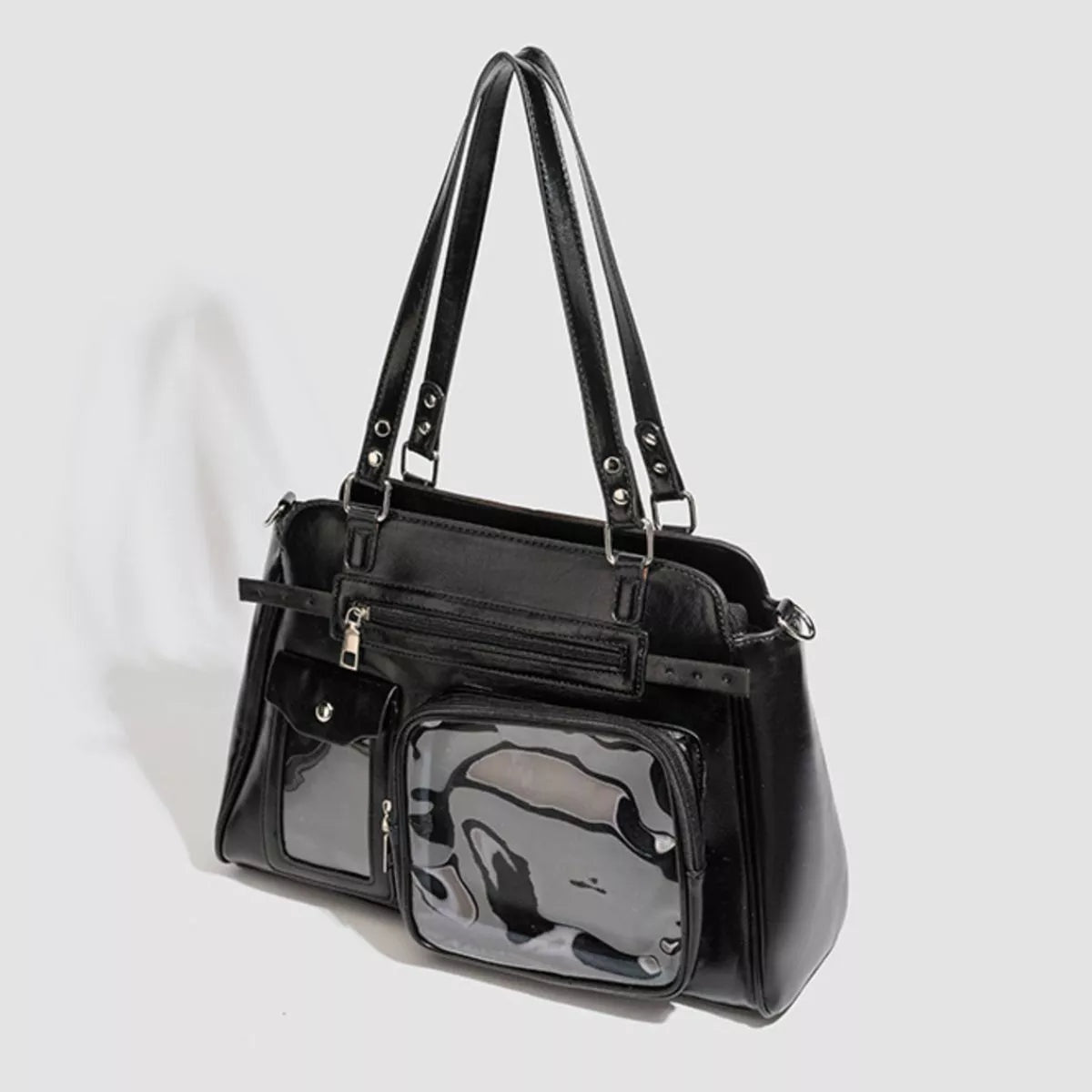 Medium black PU leather shoulder bag with dual straps, multiple front pockets, silver hardware, and a large clear window compartment.