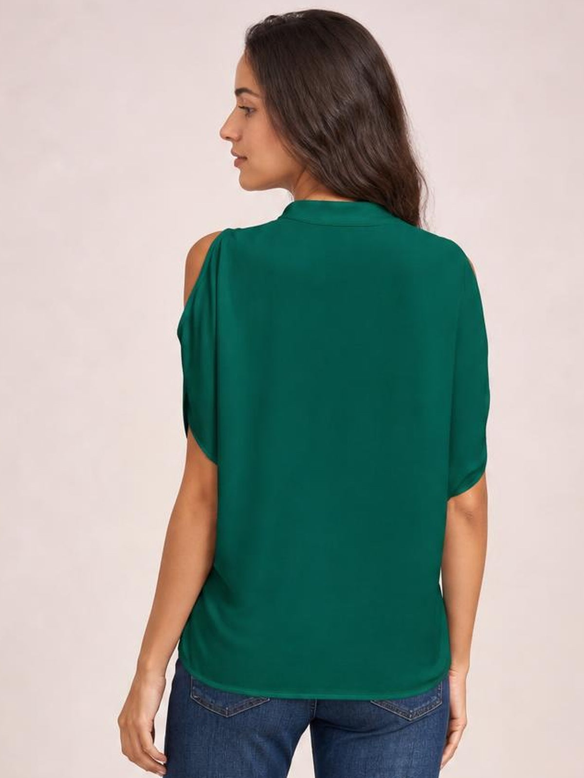 Model shown from behind wearing a teal Notched Cold Shoulder Blouse with shoulder cutouts, short sleeves, a relaxed straight silhouette, and rounded hem.
