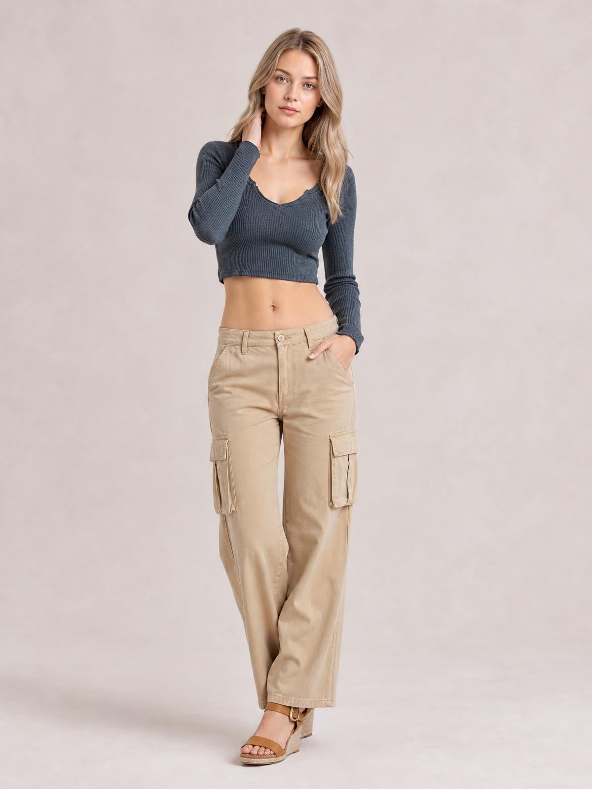 Model wears a charcoal Notched Long Sleeve T-Shirt with a ribbed texture, notched neckline, fitted cropped silhouette, and slightly stretchy construction.