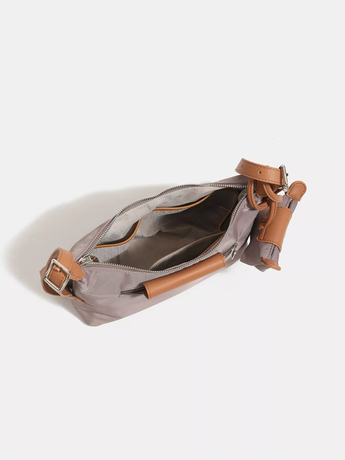 Taupe nylon hobo shoulder bag with tan trim, a top zipper, adjustable strap, spacious lined interior, and attached coin purse shown open.