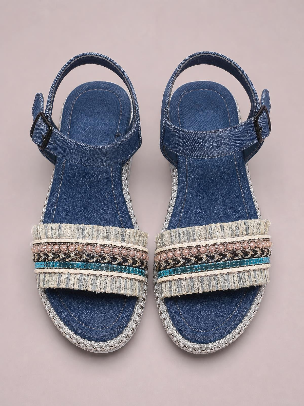 Blue denim open toe platform sandals feature embellished fringe straps, silver beaded trim, and adjustable ankle buckles.