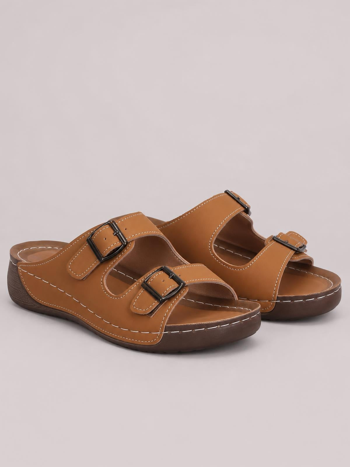 Brown open toe platform sandals in PU leather feature two adjustable buckle straps, contrast stitching, and thick flat rubber soles.