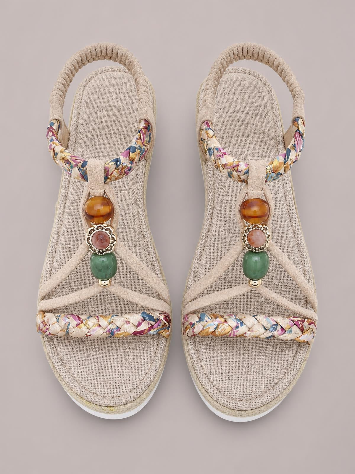 Beige open toe platform wedge sandals feature braided multicolor straps, cushioned insoles, ankle loops, and decorative amber and green bead embellishments.