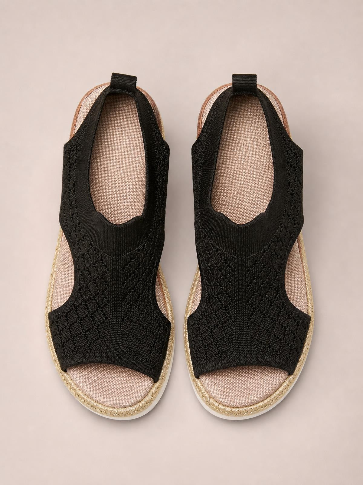 Black open-toe platform wedge sandals with textured mesh uppers, cushioned insoles, woven trim, and mid-height wedge soles.