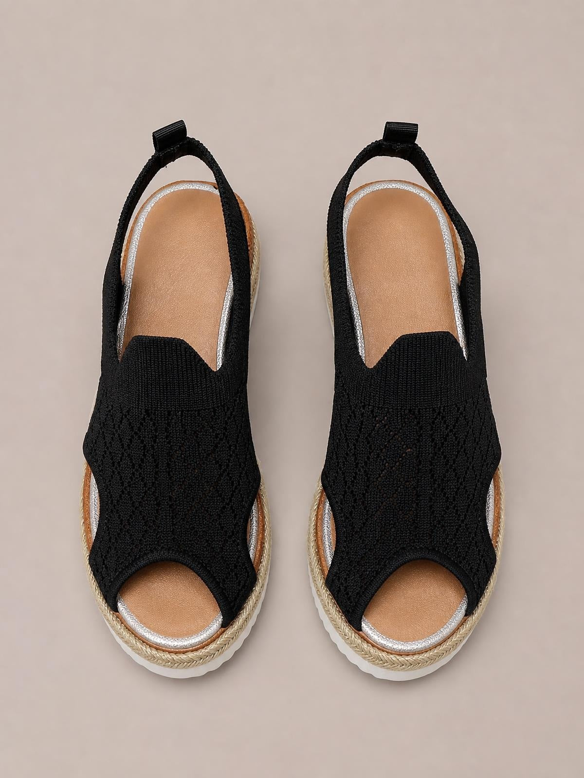 Black mesh open-toe platform wedge sandals with silver trim, slingback straps, woven midsoles, and mid-height rubber wedge soles.